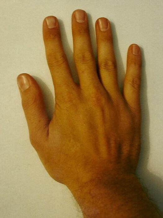 The hand of David Eastis that has authored three books.