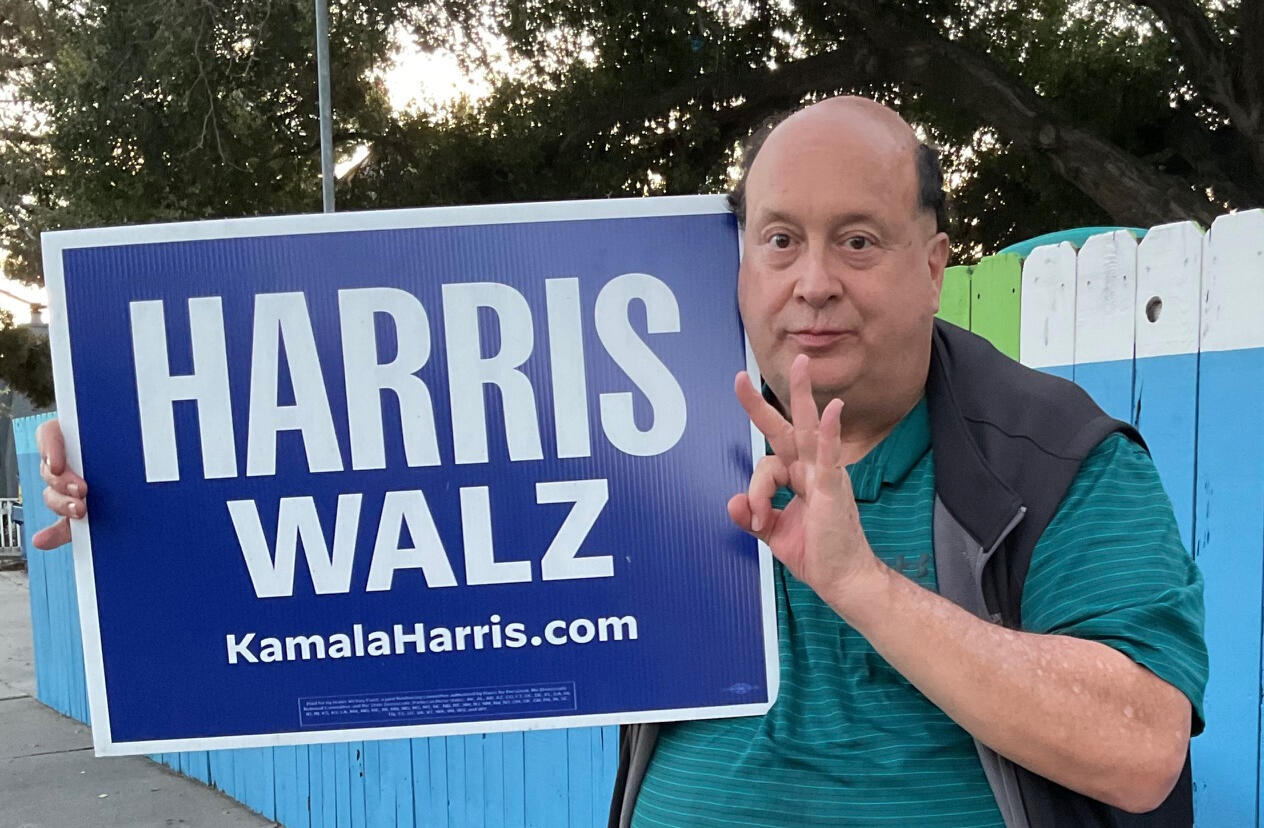 David Eastis with Harris Walz sign David Eastis with Harris Walz sign