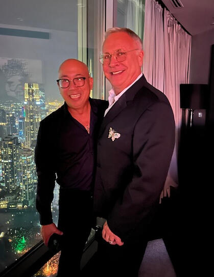 My dear friends Steve Tao, who was my Claremont McKenna College roommate and his husband Gerald in a penthouse suite in Dubai 2025 New Year festivities
