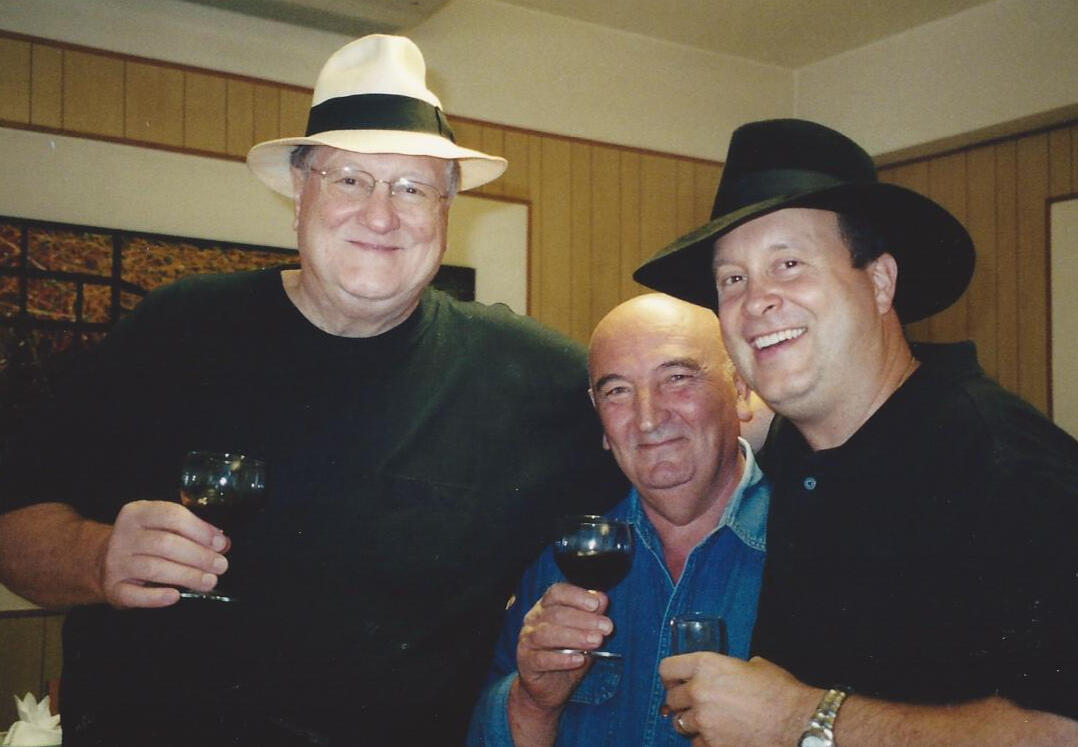 Dad and Sebastiano and David Michael Francesco donning Borsalino hats in Italy